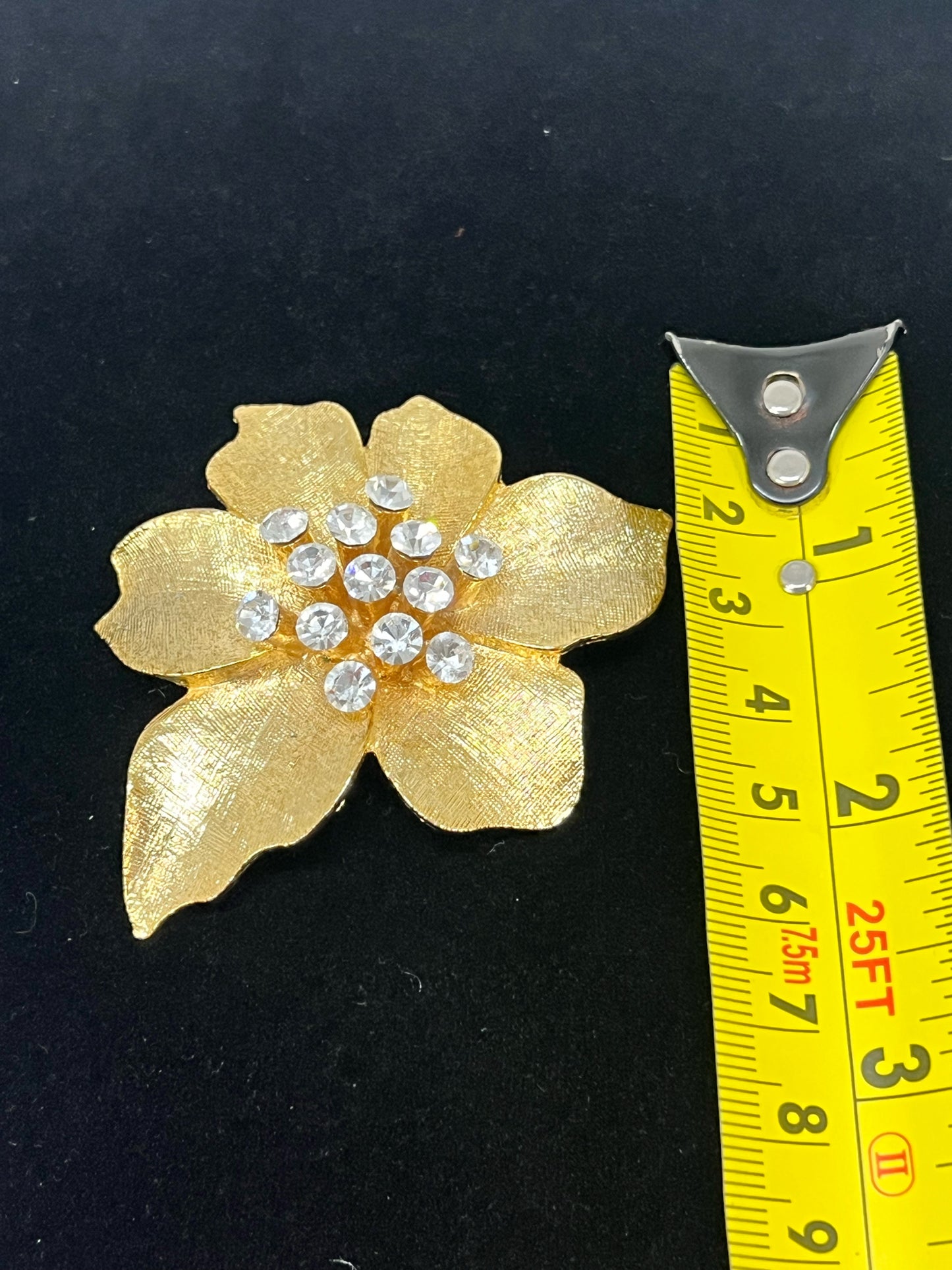 Vintage goldtone and rhinestone floral pin