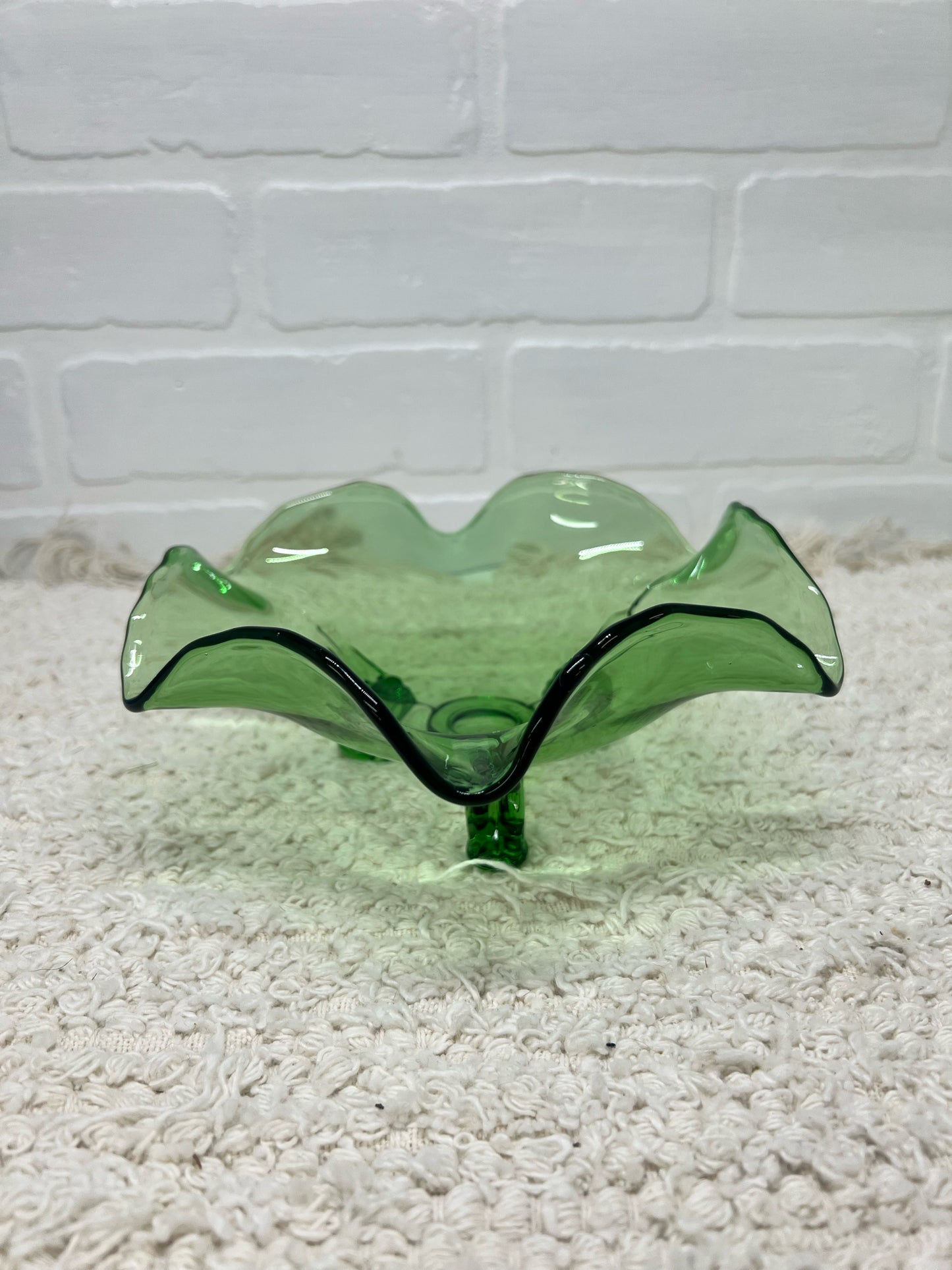 Small green glass footed bowl