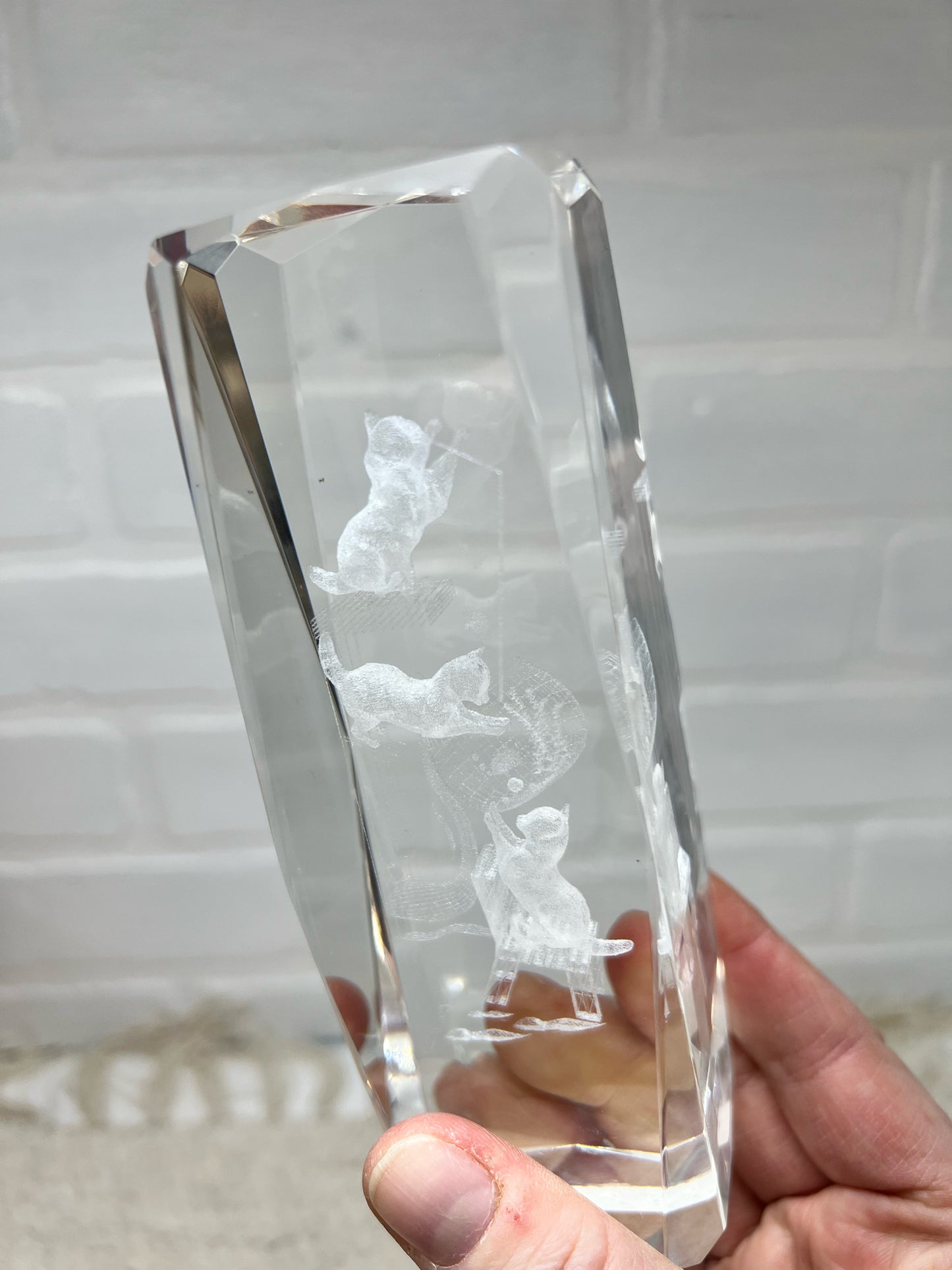 Glass etched paperweight of cats playing