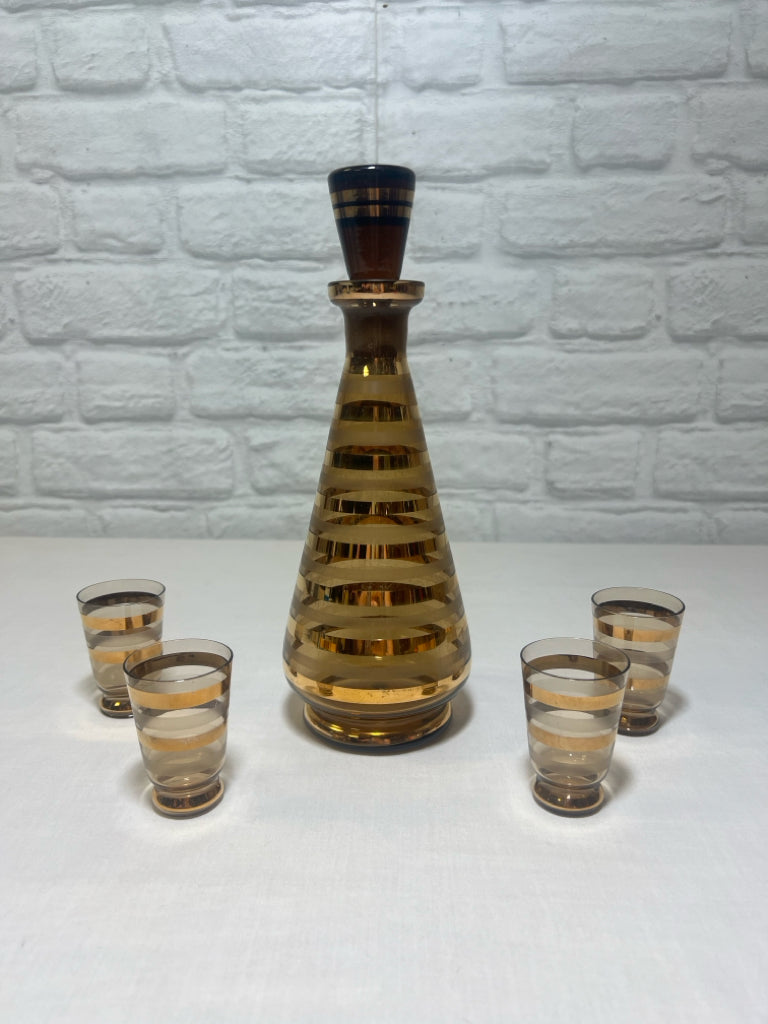 MCM Striped decanter w/ glass stopper and four glasses