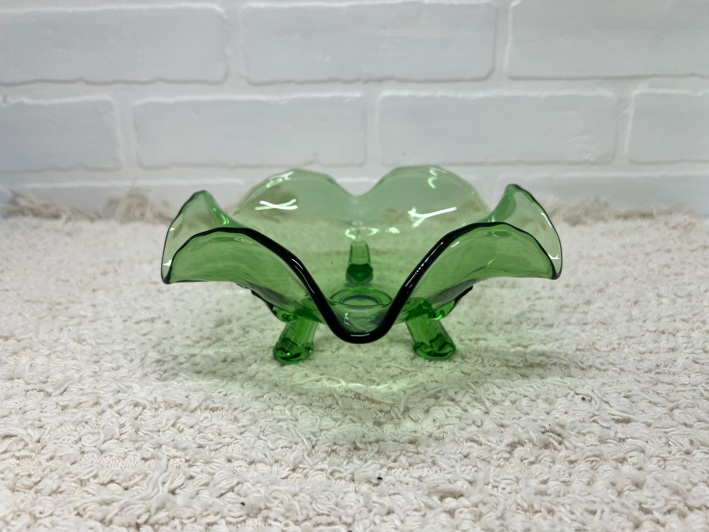 Small green glass footed bowl