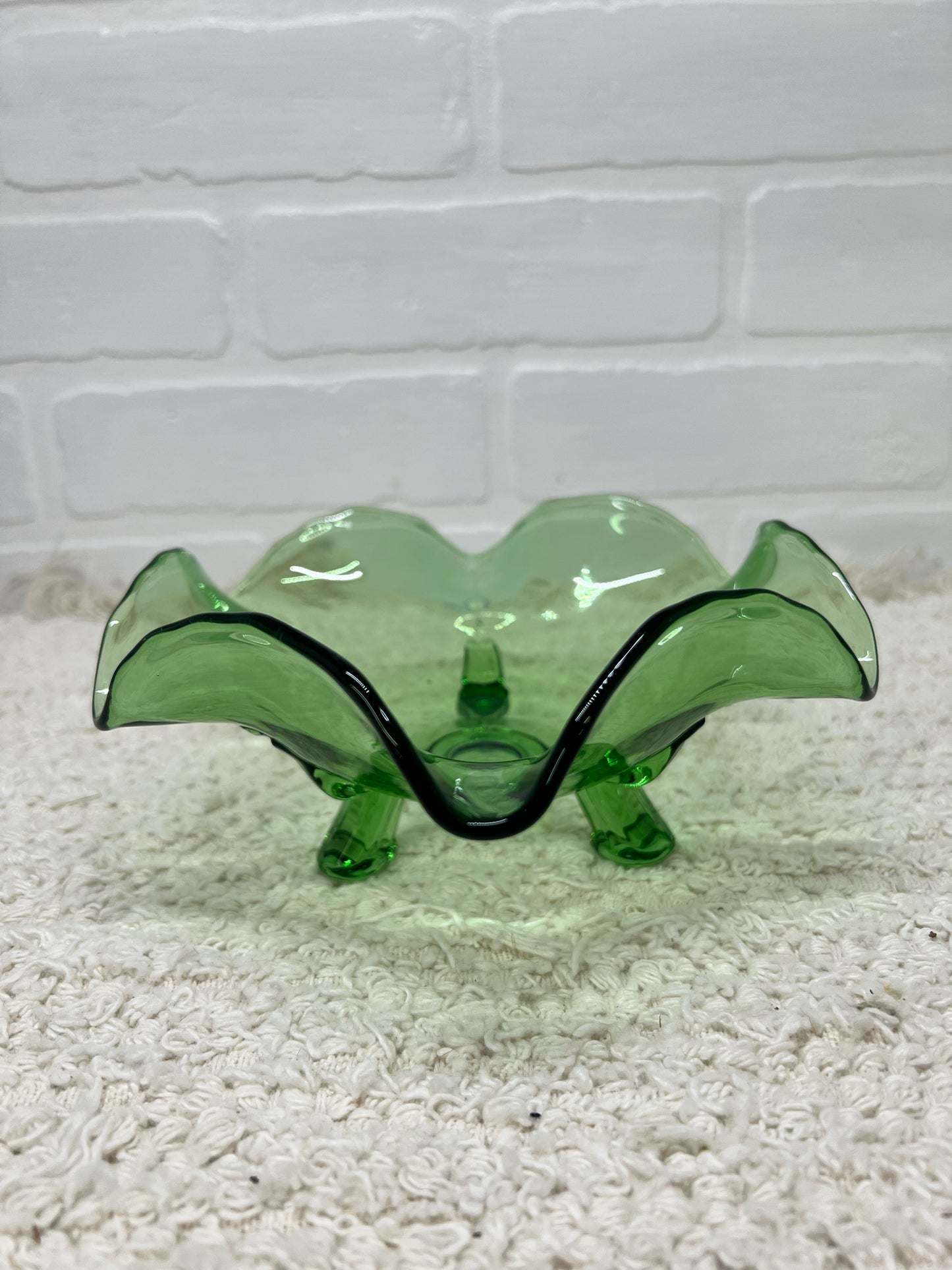 Small green glass footed bowl