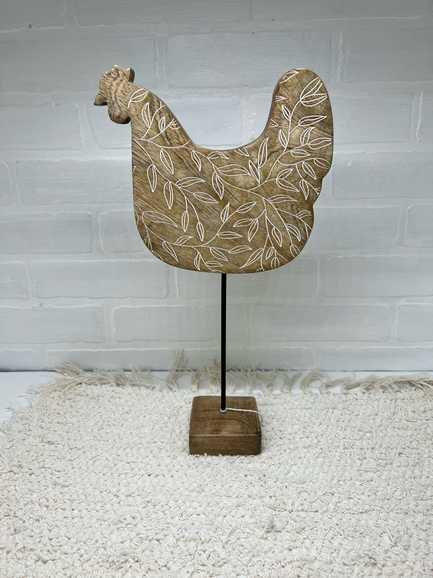 Floral wood chicken on a stand