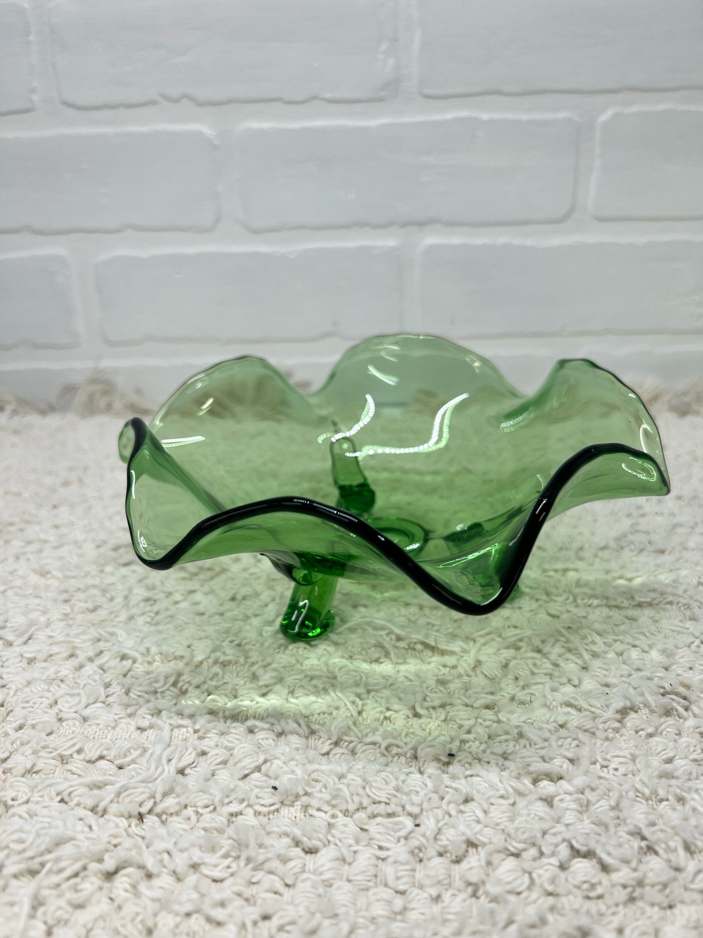 Small green glass footed bowl