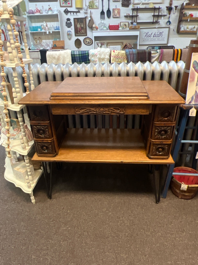 Vintage wood table made from sewing machine table