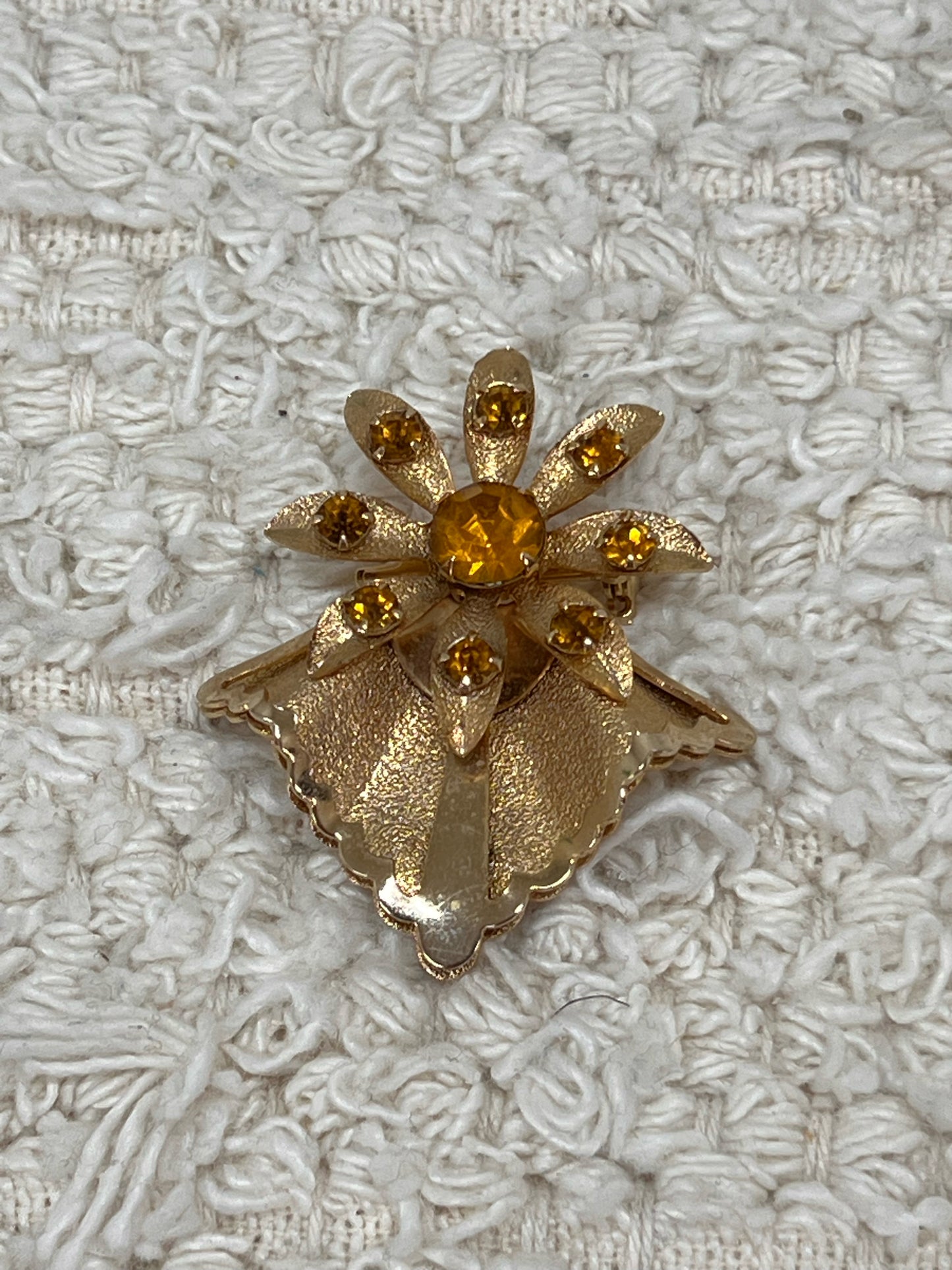 Goldtone vintage flower pin w/ amber colored stones