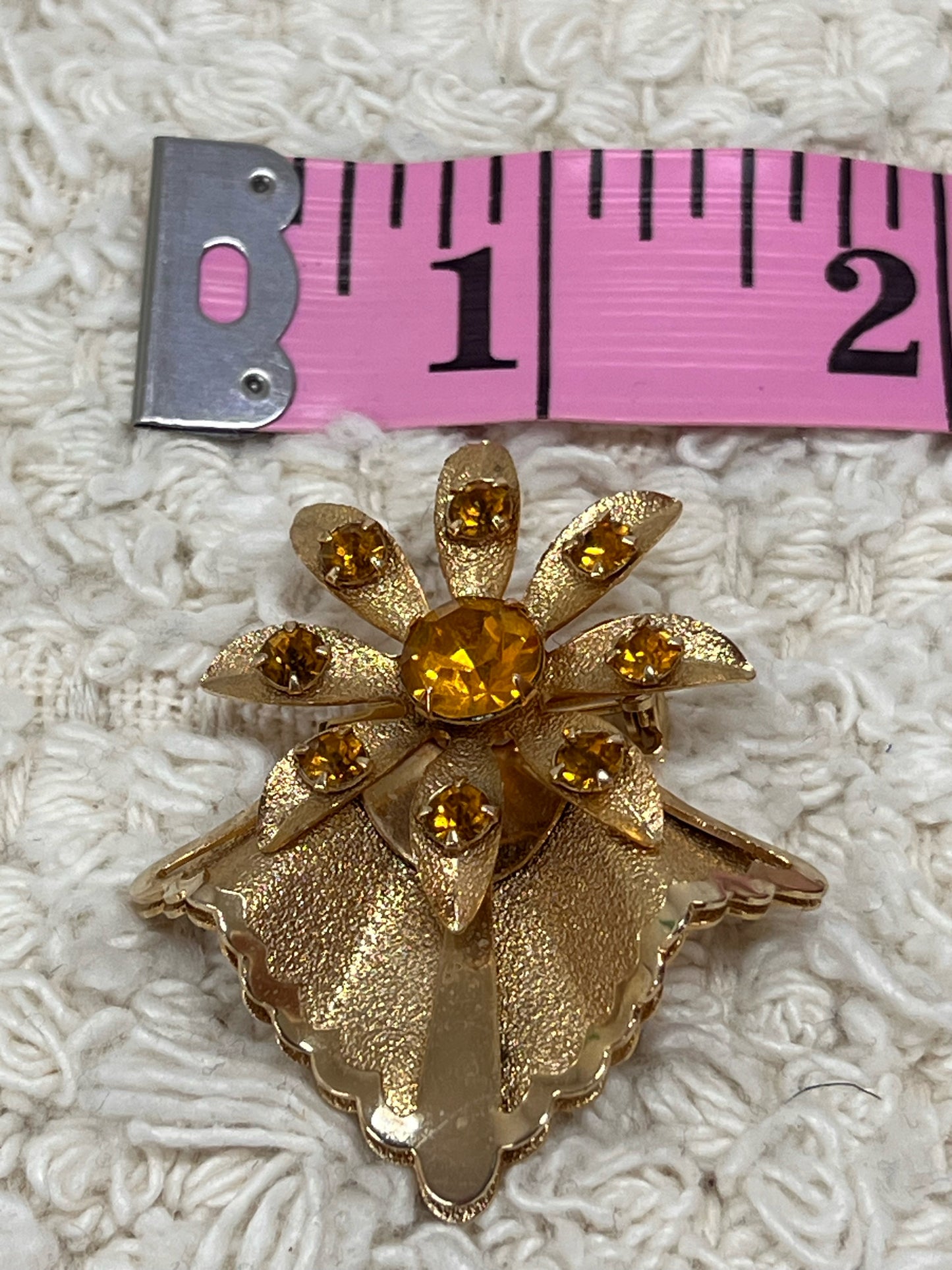 Goldtone vintage flower pin w/ amber colored stones