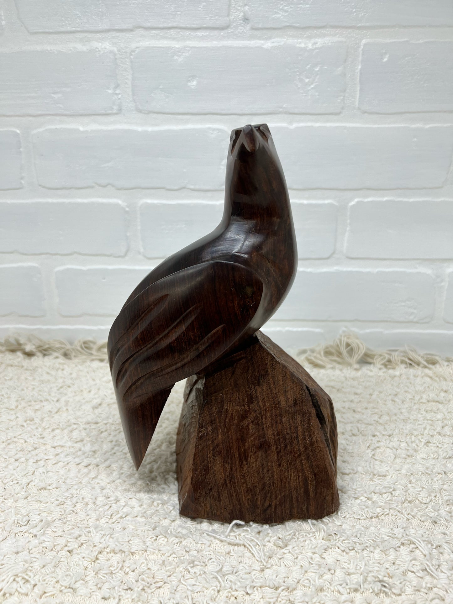 Wood carved bird statue